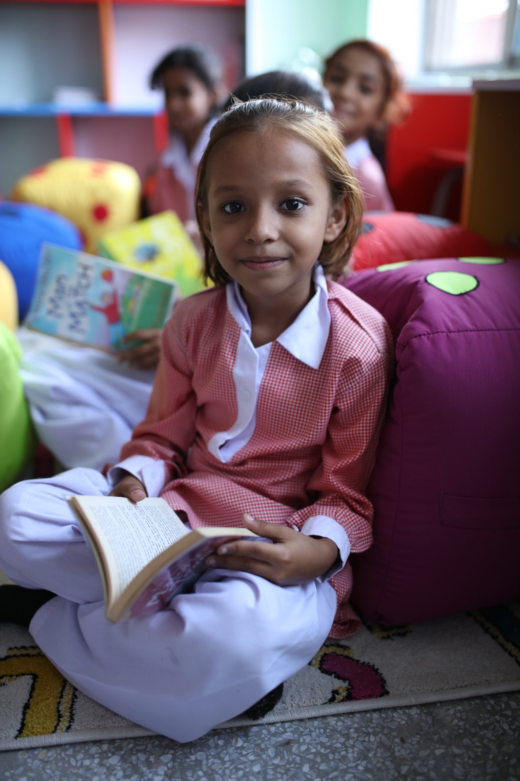 Student reading with focus